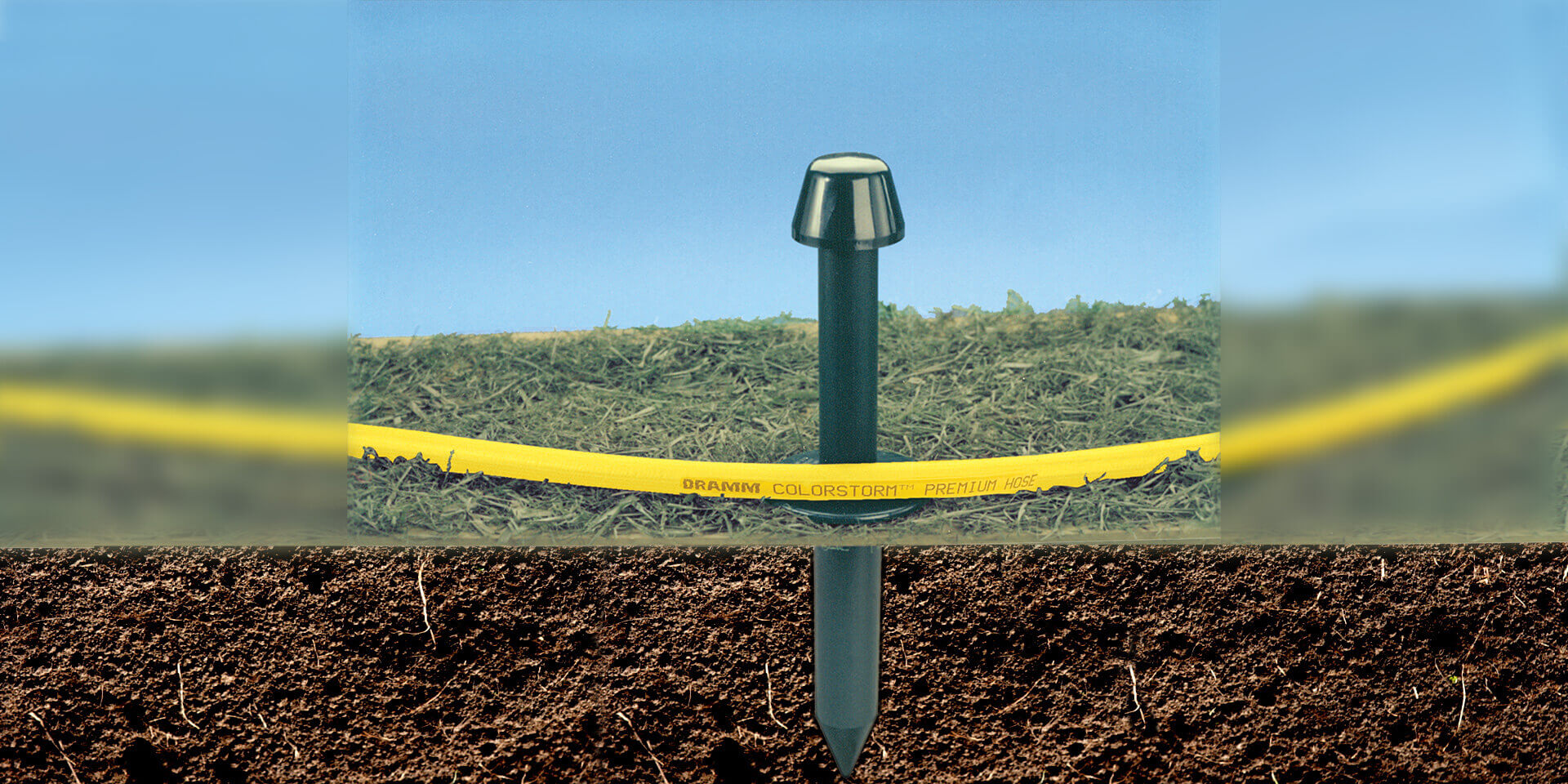 Dramm Garden Gard, shows underground and above ground view of hose guide installed in a lawn.