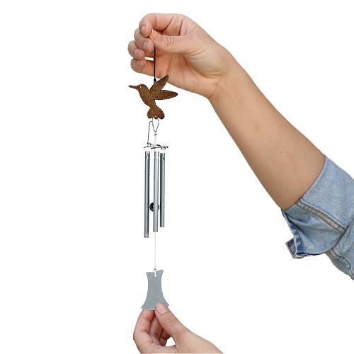 Jacob's Musical Chimes hand tuned wind chime hummingbird held in hand for size.