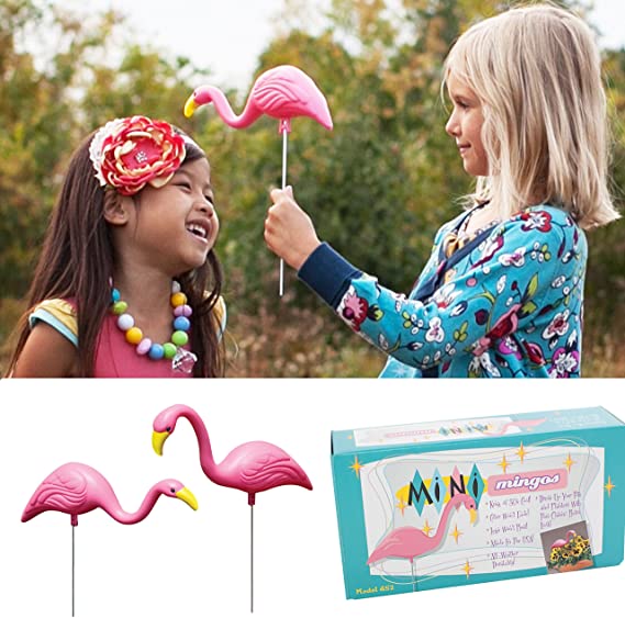 Mini Pink Flamingos being played with by 2 little kids.
