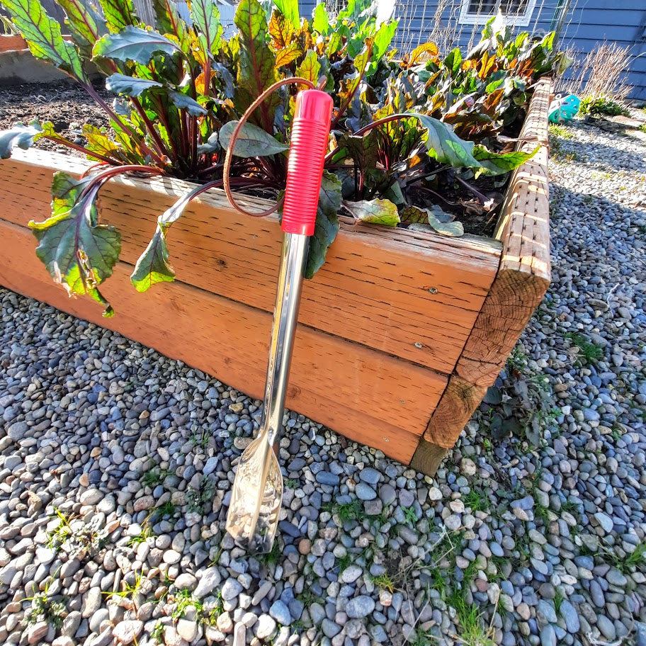 Wilcox 22 inch stainless steel trowel with red handle and leather wrist strap